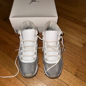 Women’s Jordan 11, size 9.5, white/metallic silver